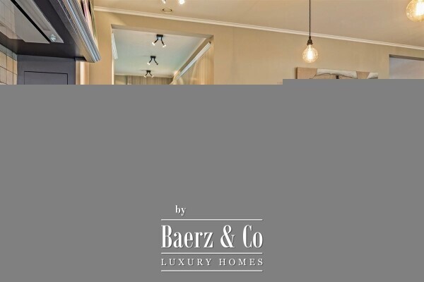 photo 8 Uitzonderlijke Duplex met zicht op kanaal, garage, carport en ruime (wijn)kelder!