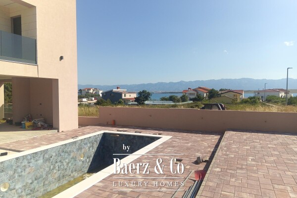 photo 1 Vir, Luxury villa with a pool in the first row to the sea